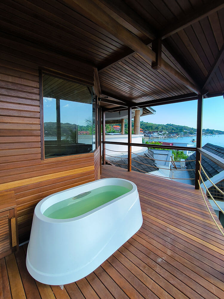 Sauna with panoramic ocean-facing windows at Segara Seaside Resort